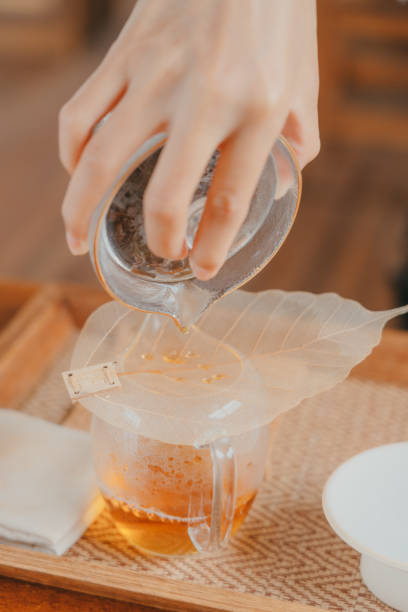 istock An woman is brewing the tea 1341878329