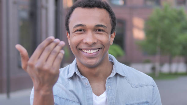 istock Outdoor, African Man Inviting New People 1341878514