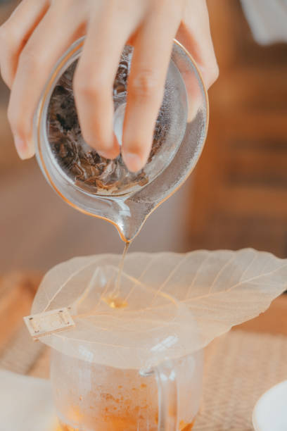 istock An woman is brewing the tea 1341878653