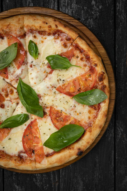 istock margarita pizza on a wooden board 1341878990