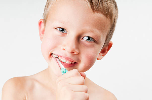 Boy Brushing Teeth stock photo