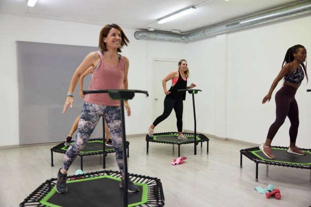 istock Aerobics and fitness trampoline class. 1341880106