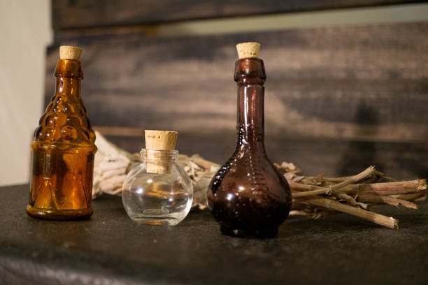 istock Antique glass bottles with sage 1341880153