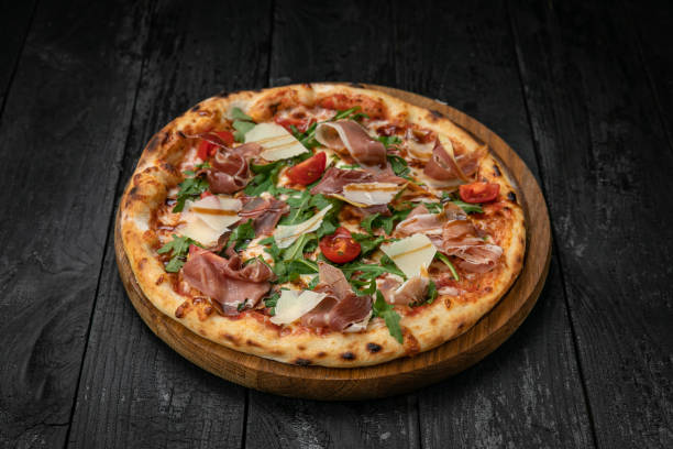 istock pizza with meat, parmesan and tomatoes 1341880559