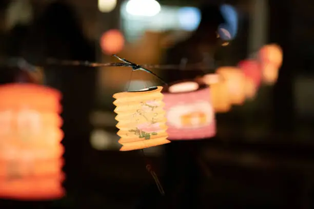 Colorful Illuminated Lanterns hanging outdoor. Moon cake festival, Mid-Autumn Festival, Chinese lantern Festival