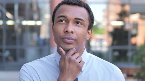 istock Outdoor African Businessman Thinking New Idea 1341881717