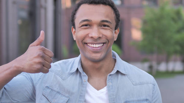 istock Thumbs Up by African Man, Outdoor 1341883028