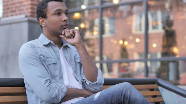 istock Thinking African Man Sitting Outdoor 1341884308