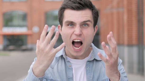 istock Angry Young Man Yelling Outdoor 1341884643