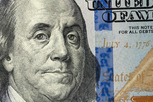 Portrait of Benjamin Franklin. Face Franklin on USA 100 dollar bill closeup isolated. America money