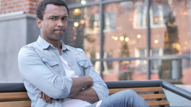 istock No, Rejecting Young  African Man Sitting on Bench 1341886005