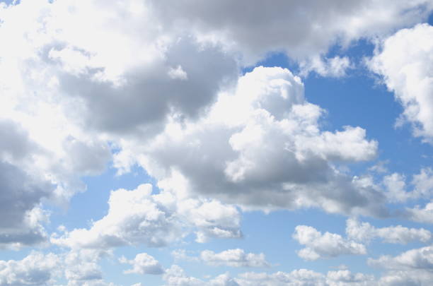 The sky with clouds in sunny weather. Cumulus clouds.