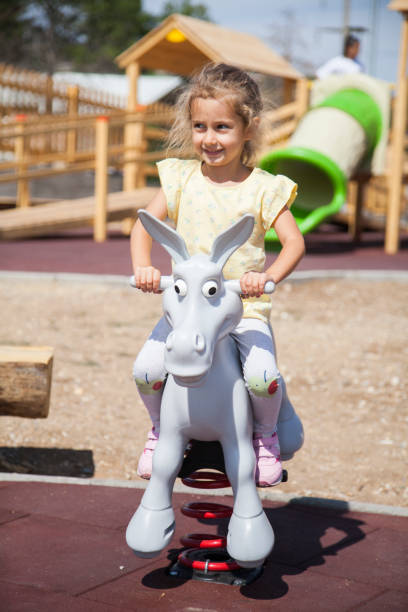 istock Little Girl Swinging 1341890533