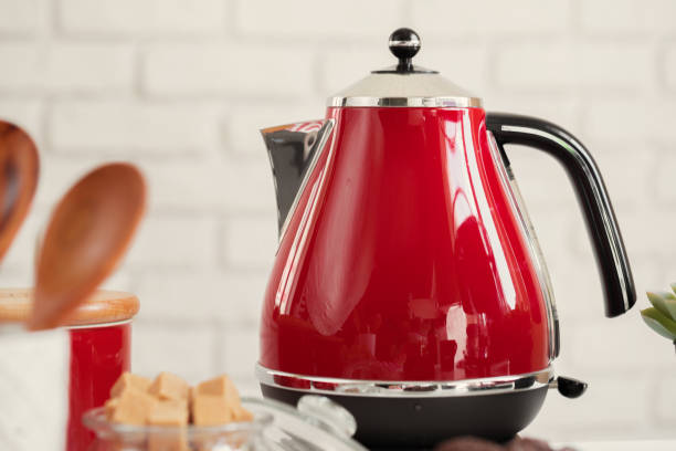 istock Vintage style red electrical teapot in kitchen interior 1341891910
