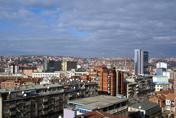 Downtown Prishtina - Kosovo Prishtina, Kosovo: The Kosovo Assembly (Parliament) building in the capital city. Strong winds over the city bring hope for a better political climate. pristina stock pictures, royalty-free photos & images