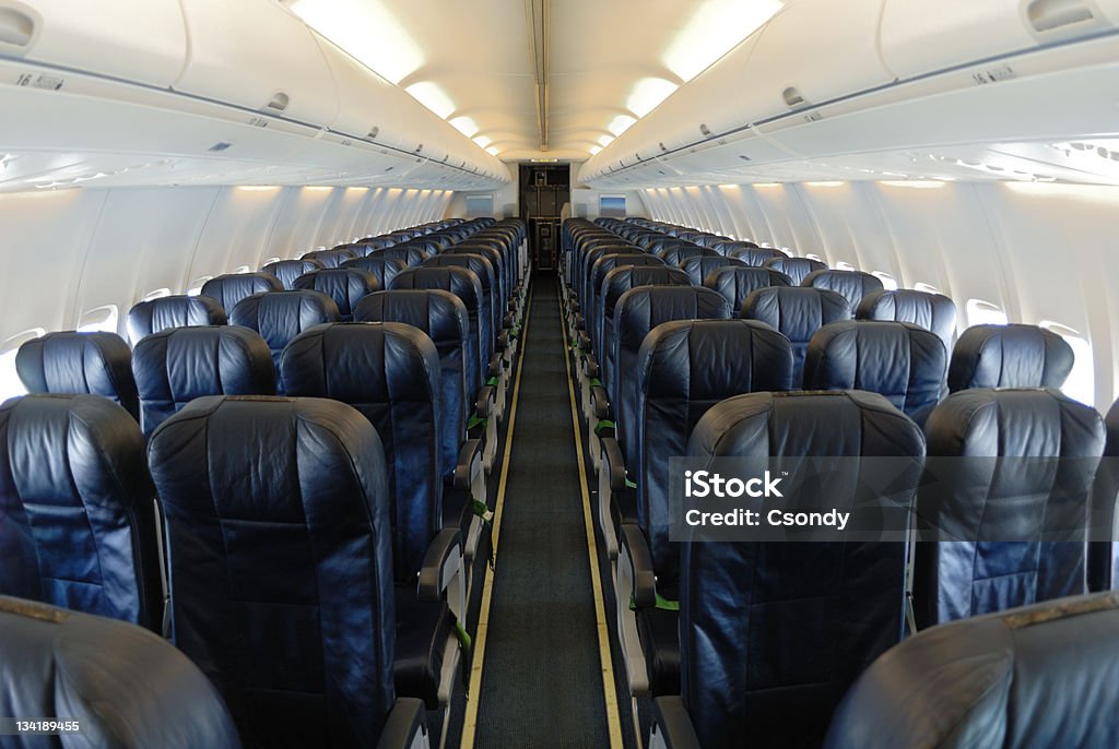 Empty aircraft interior Inflight image from an empty aircraft interior. Seat Stock Photo