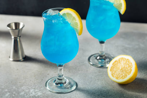 Refreshing Boozy Blue Hawaii Cocktail Refreshing Boozy Blue Hawaii Cocktail with Lemon blue hawaiian stock pictures, royalty-free photos & images