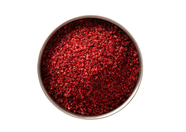 Sumac in a bowl isolated on a white background