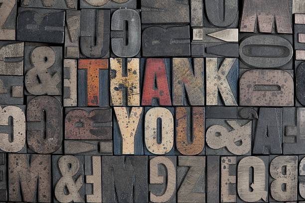 Grunge thank you sign in typefaces with metal stock photo