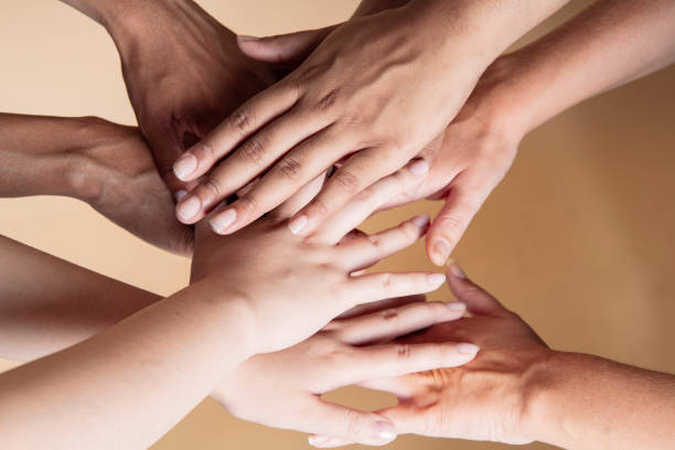 many hands of multi-ethnic women of different skin color many hands of multi-ethnic women of different skin color skin tones stock pictures, royalty-free photos & images