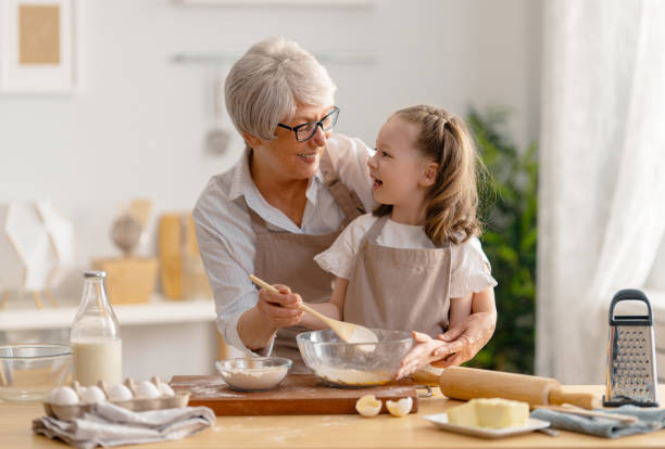 istock family are preparing bakery together 1341900395