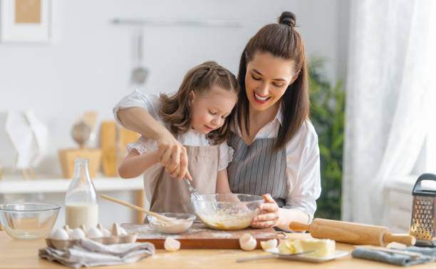 istock family are preparing bakery together 1341900411