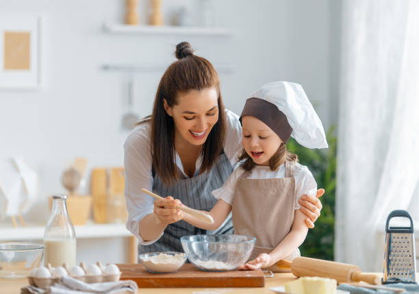 istock family are preparing bakery together 1341901097