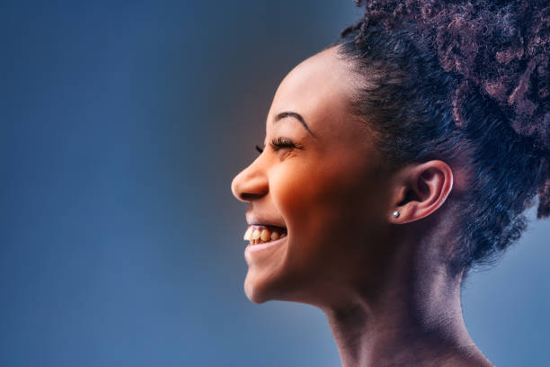 istock Happy young woman with a vivacious beaming smile 1341901195