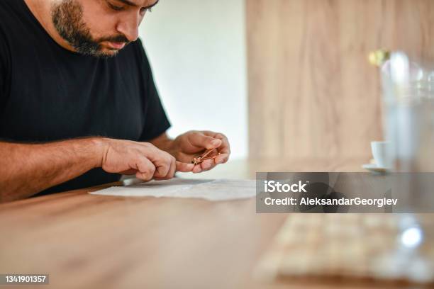 Adult Male Cutting Fingernails On Table Stock Photo - Download Image Now - Nail File, 35-39 Years, Adult