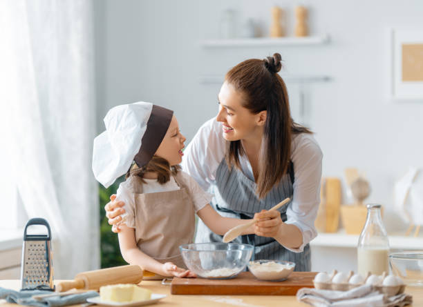 istock family are preparing bakery together 1341901489