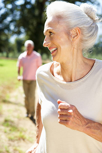 istock Senior couple on country run 134190160