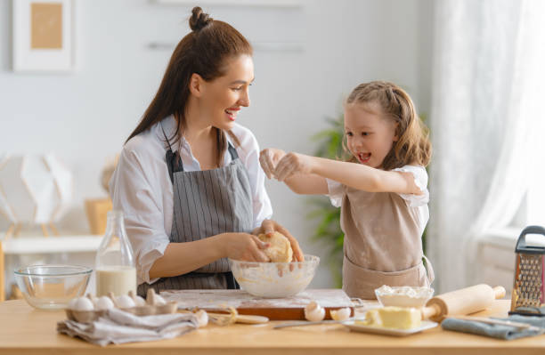 istock family are preparing bakery together 1341901844