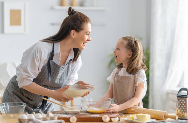 istock family are preparing bakery together 1341901867