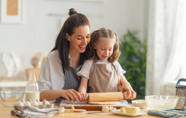 istock family are preparing bakery together 1341901901