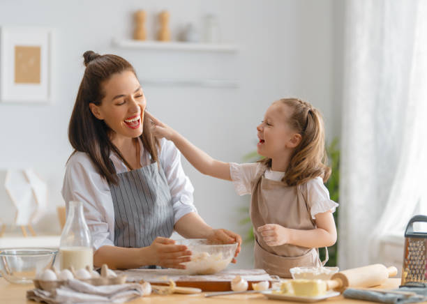 istock family are preparing bakery together 1341901991