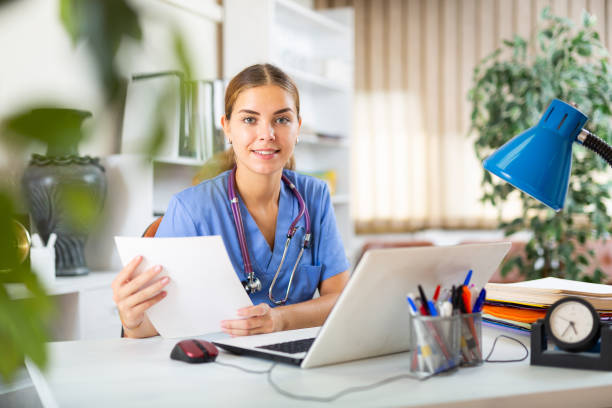 istock Young female doctor working in her office 1341904611