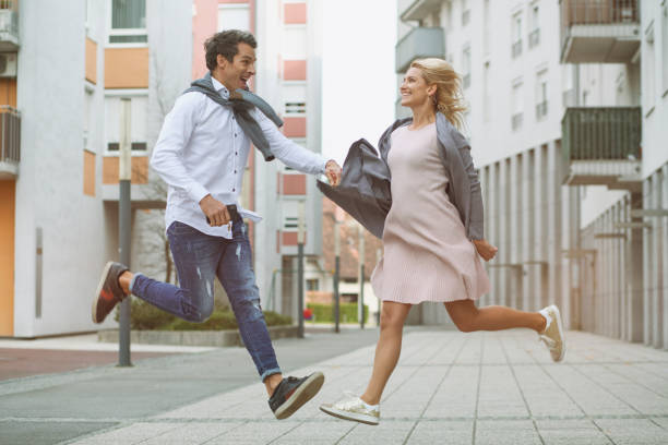 istock Couple mid-air in a residential district. 1341905214