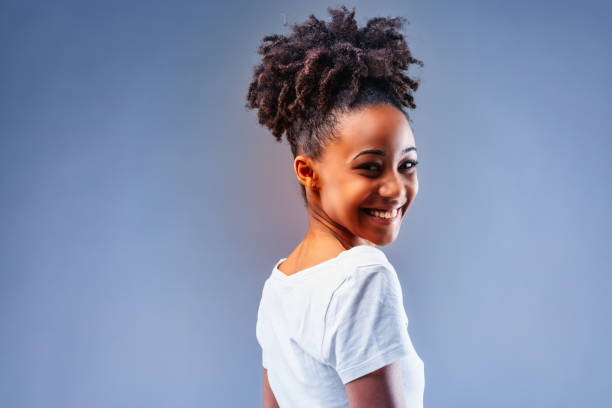 istock Vivacious young Black woman with a happy friendly smile 1341905353