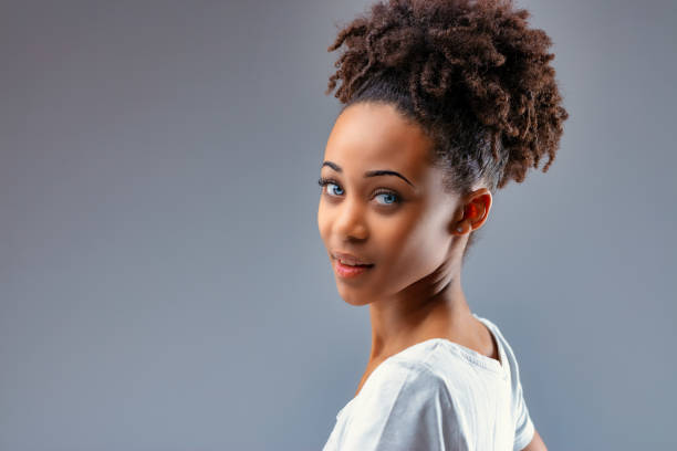 istock Beautiful young Black woman with piercing blue eyes 1341905364