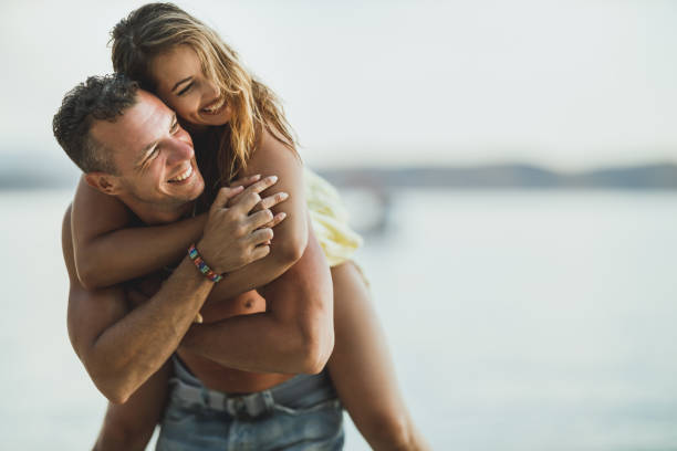 istock Loving Couple Enjoy Summer At The Beach 1341906209