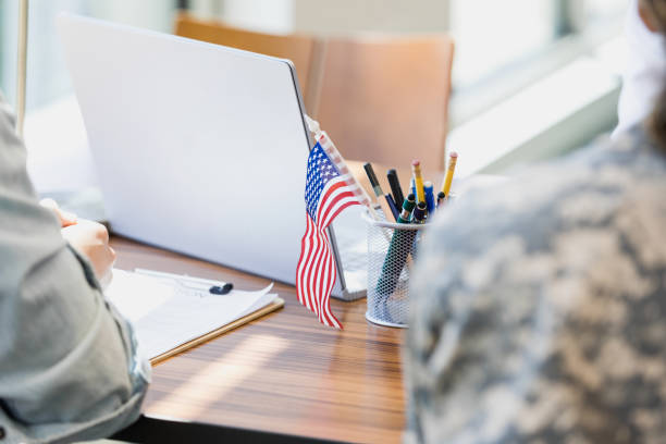 istock With focus on American flag, couple waits patiently for assistance 1341908218