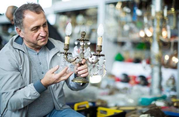 istock Active middle aged man buying retro handicrafts 1341909623