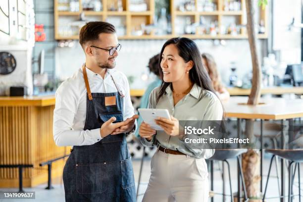 Managing A Small Business Stock Photo - Download Image Now - Small Business, Customer, Manager