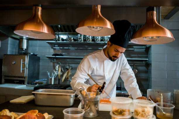 istock Professional chef cooking at a restaurant 1341912064
