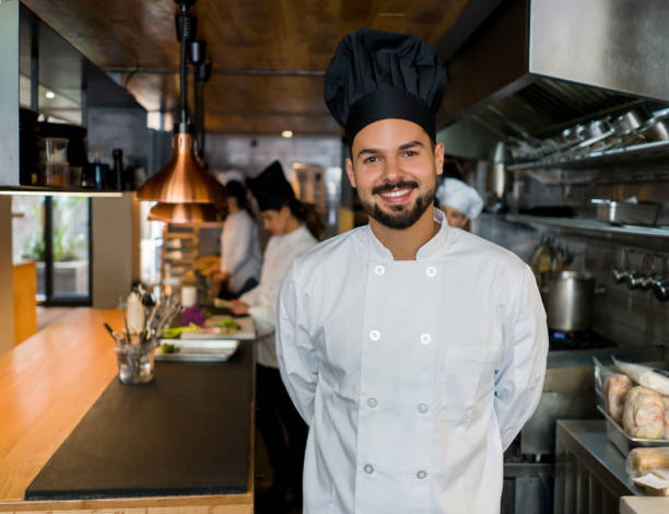 istock Portrait of a happy chef working at a restaurant 1341912085