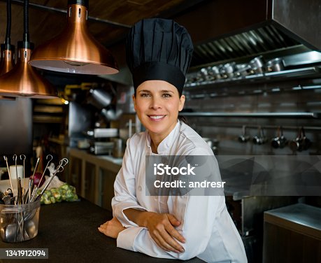 istock Portrait of a successful chef at a restaurant and smiling 1341912094
