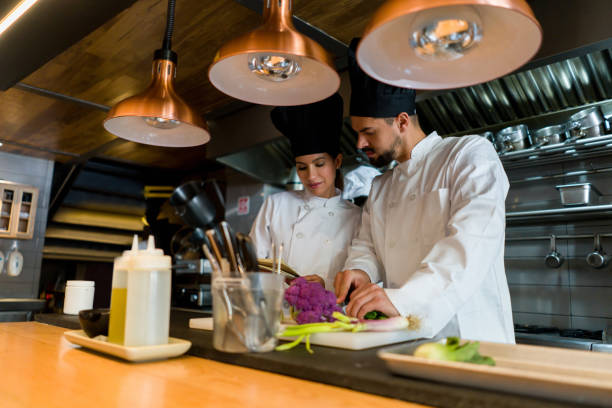 istock Chefs working together at a restaurant and sharing ideas about recipes 1341912096