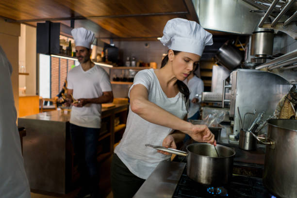 istock Group of chefs cooking at a restaurant 1341912126
