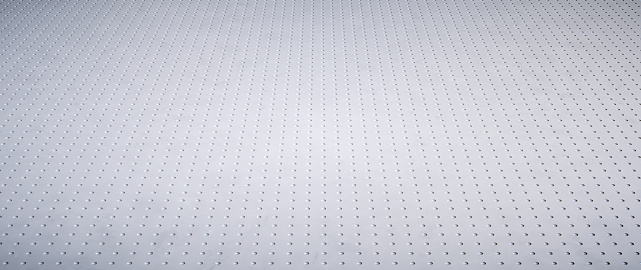 Simple surface background in white color with small holes and diminishing perspective. Wide horizontal composition.