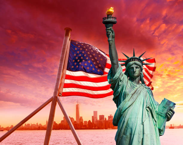 istock Liberty Statue New York skyline American flag 1341913663